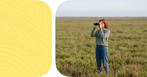 Woman looking through binoculars.